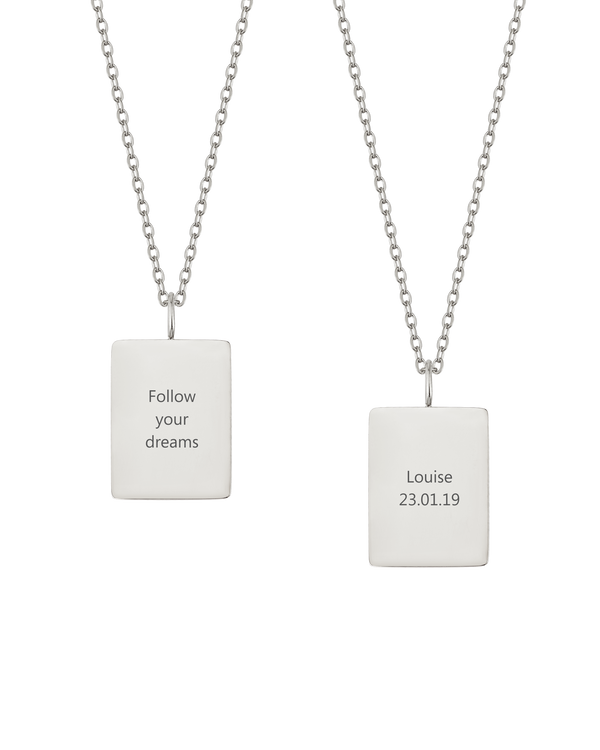 RAZ halsband från byRavn i silverfärgat rostfritt stål, två rektangulära hängen med "Follow your dreams" och "Louise 23.01.19" graverat
